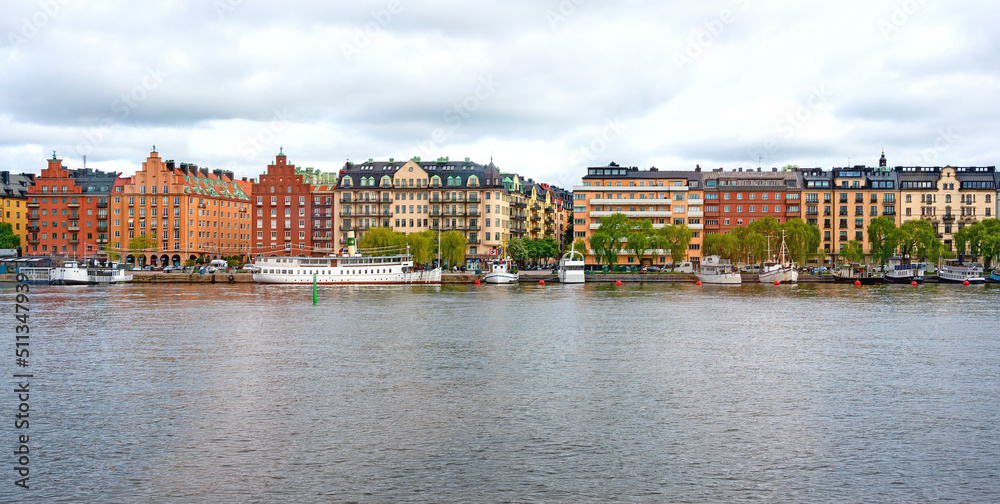 Colorful buildings and some boats on the embankment of Mälarstrand in Stockholm, Sweden