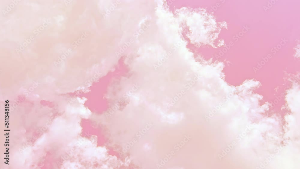 White thick clouds float in the soft pink sky. Abstract background. 