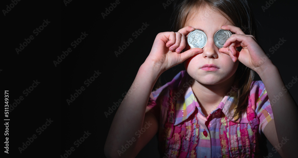 US Dollar coins in front of eye as symbol of love to money and strong motivation. Horizontal image. US Dollar coins in front of eye as symbol of love to money and strong motivation. Horizontal image.