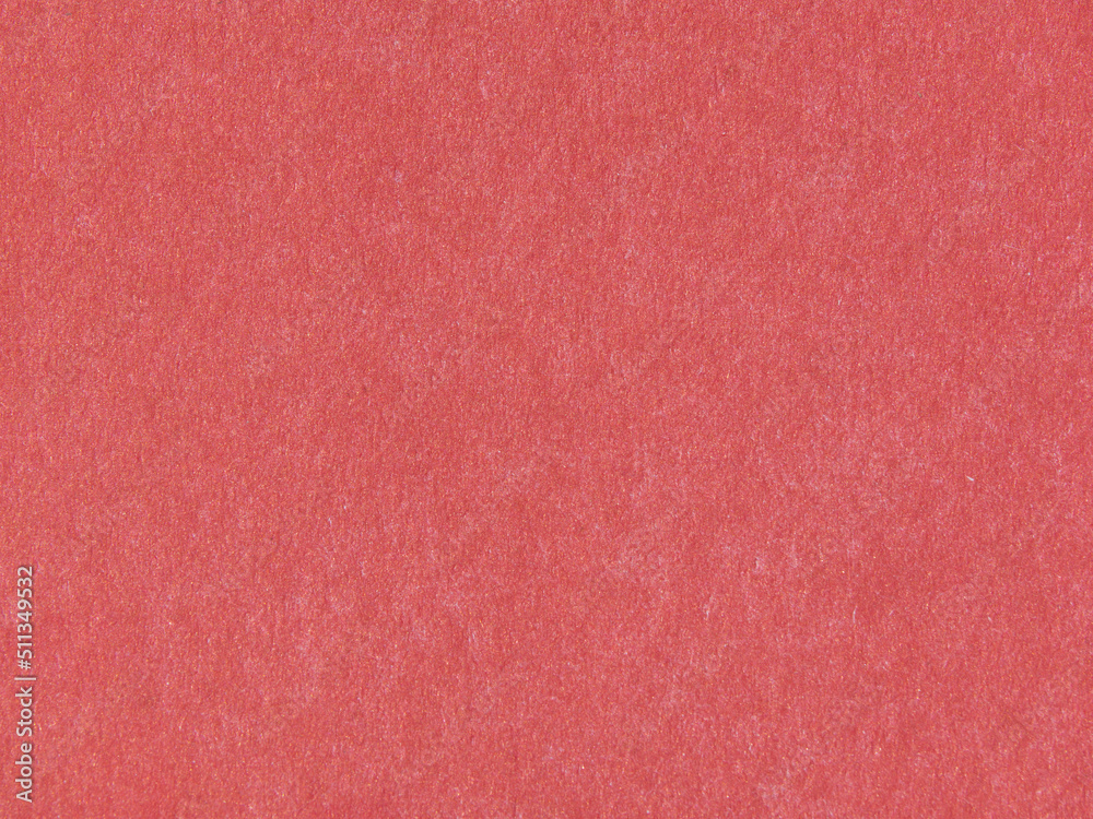 Macro natural texture of red paper or grunge background. A sheet of red paper. Rough textured surface. Wallpaper for your luxury design