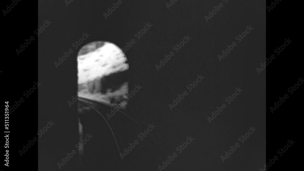 Through the Train Tunnels 1933 - Views from the caboose of a train as it passes through tunnels in 1933.