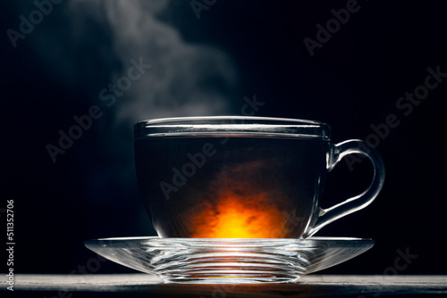 One cup of hot black tea on a dark background, hot tea, studio photo