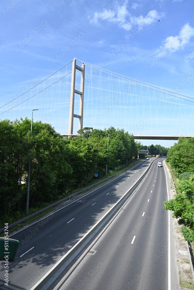 cars and lorry traveling under the Humber Bridge on the A63 Hessle. UK