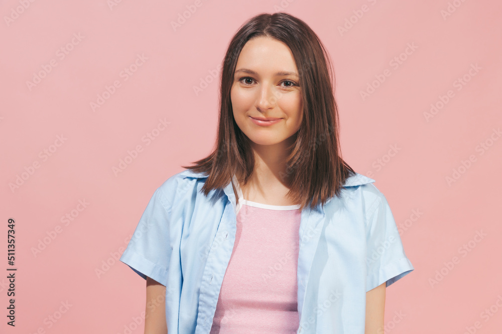 Young beautiful girl wearing top and summer shirt looking at camera isolated on pink background. Concept of emotions, facial expression, youth Young beautiful girl wearing top and summer shirt looking at camera isolated on pink background. Concept of emotions, facial expression, youth