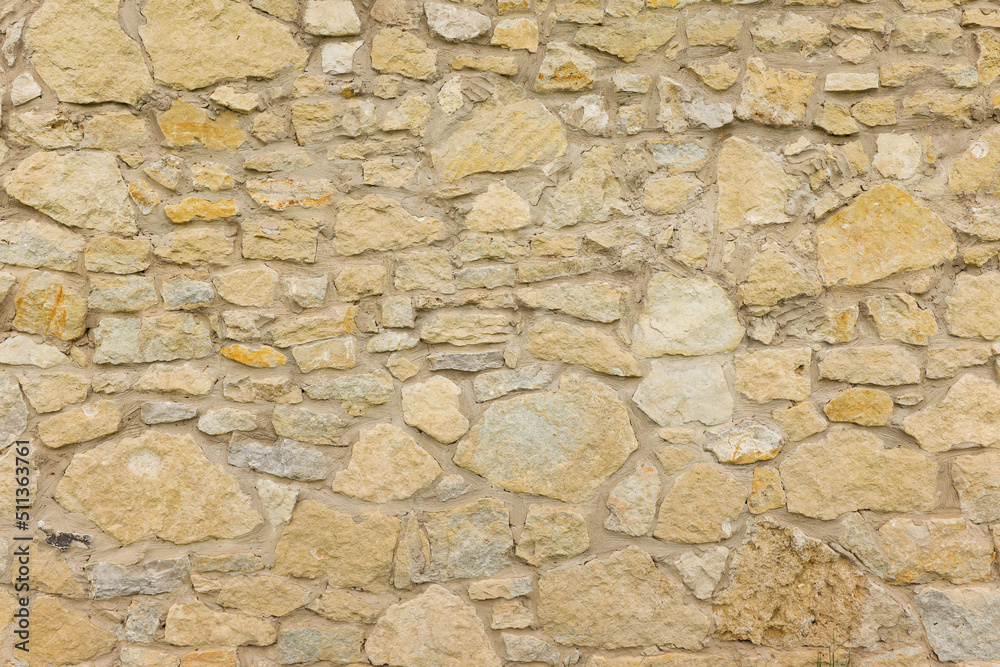 Beige stone wall texture background