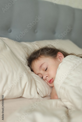 Cute girl sleeping in bed