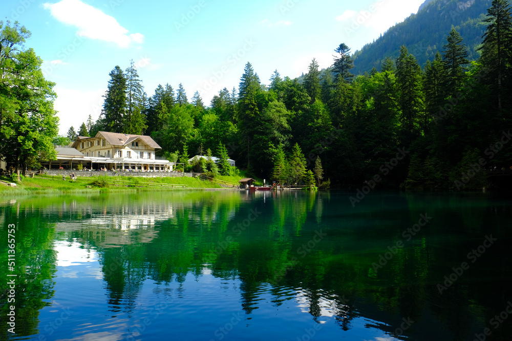 Selective focus of house at Blausee Lake with reflection. The myth of this place is the lake water are from women cry.