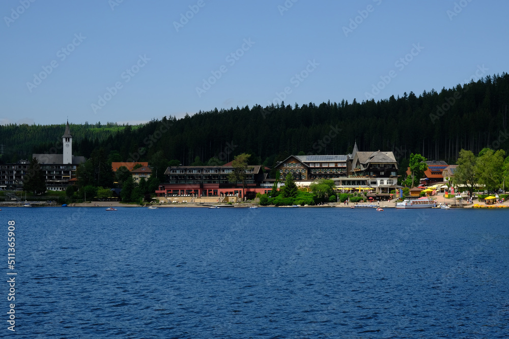 A picture of Titisee lake wirh famous hotel and other attraction insight. Titisee is one of famous holiday place in Black Forest. A picture of Titisee lake wirh famous hotel and other attraction insight. Titisee is one of famous holiday place in Black Forest.