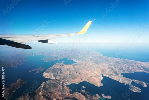 View from the plane window to the Turkish mountains in the Fethiye region and the blue sea