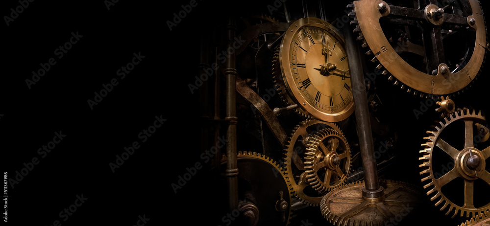 The mechanism of an old antique watch in the dark. Surrounded by black space. - obrazy, fototapety, plakaty 
