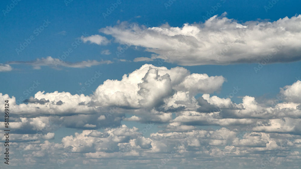 Fototapeta premium White porous clouds on blue sky, sky with clouds, cloudy landscape