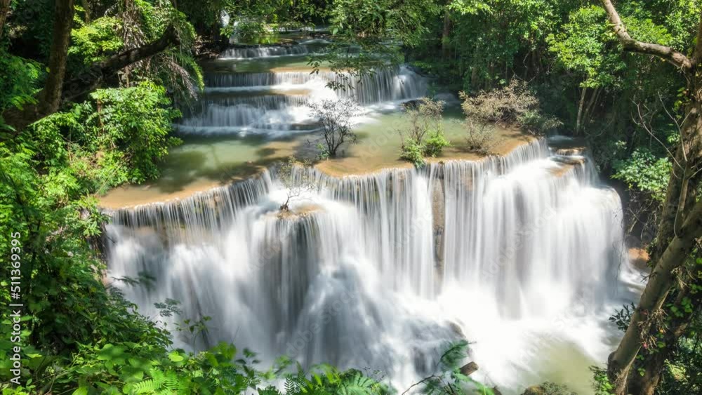 Time lapse of beautiful 4th floor Huay Mae Khamin waterfall flowing in tropical rainforest at national park Time lapse of beautiful 4th floor Huay Mae Khamin waterfall flowing in tropical rainforest at national park