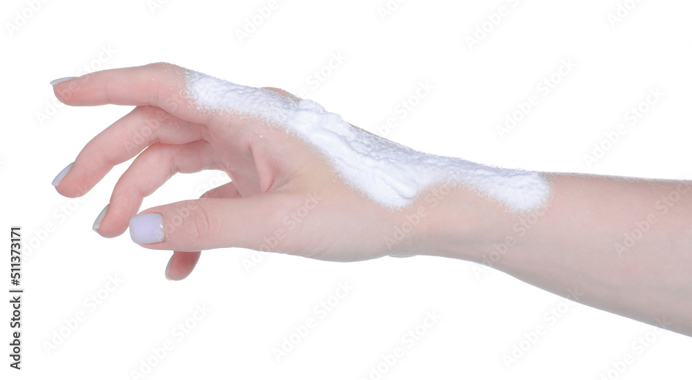 Female hand with white foam panthenol on white background isolation Female hand with white foam panthenol on white background isolation