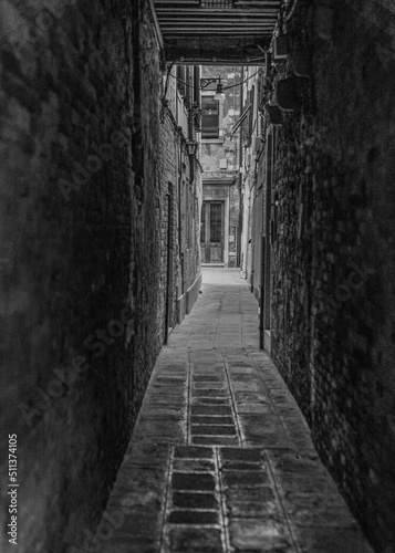 black and white narrow street alley in Venice  Italy 