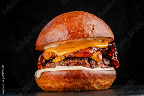 Obraz na plátne tasty burger on the dark background