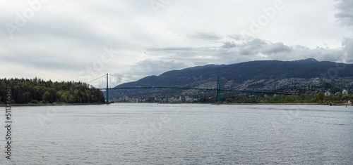 Lions Gate Bridge in a modern city on the West Coast of Pacific Ocean. Vancouver, British Columbia, Canada. Panorama