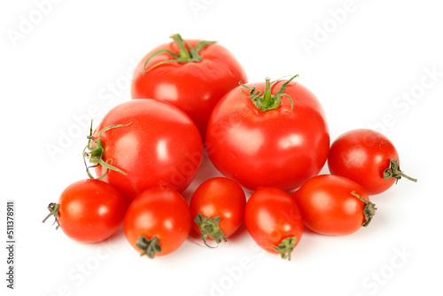 Fresh organic tomatoes on a white background, ripe vegetables.