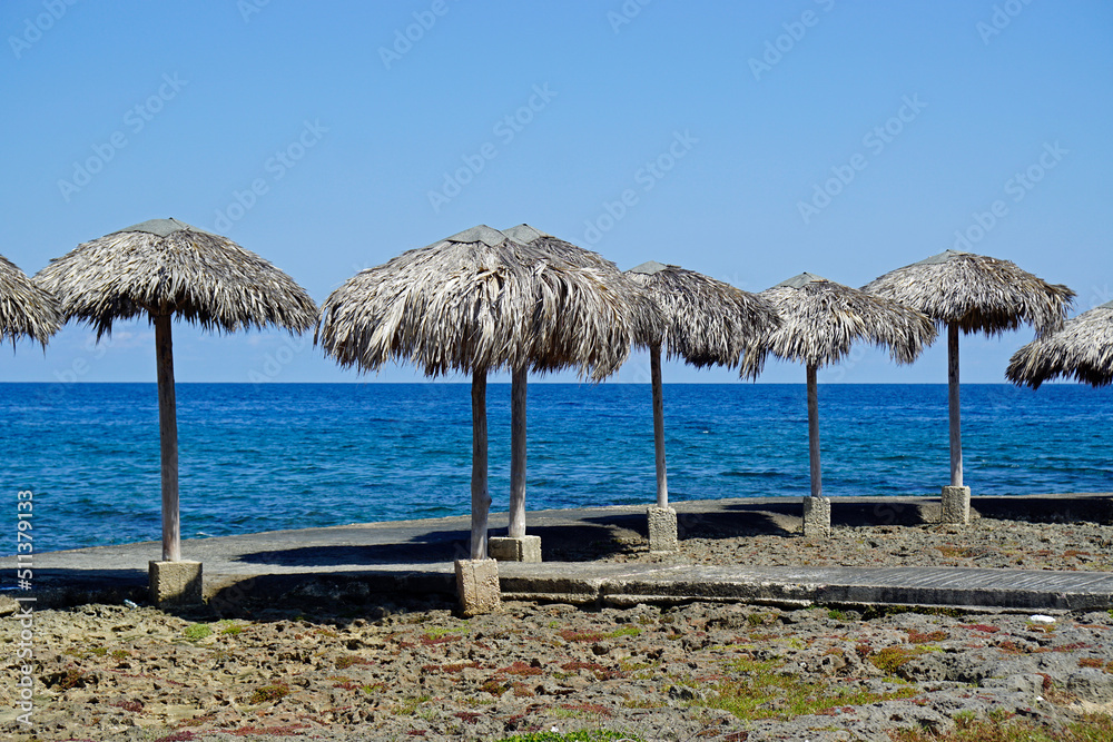 wooden sunshades at the beach of havana miramar