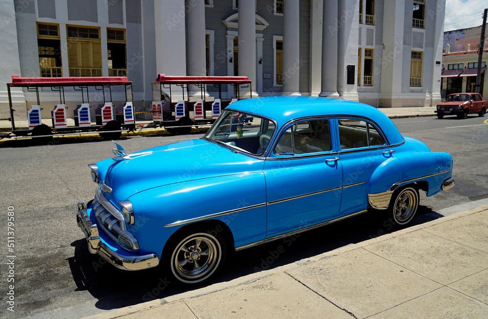 blue classic car in the streets of Cienfuegos blue classic car in the streets of Cienfuegos