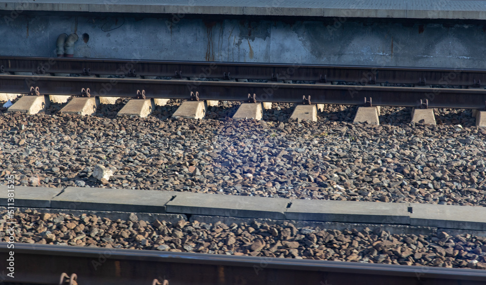 Railway rails and crushed stone at the platform.