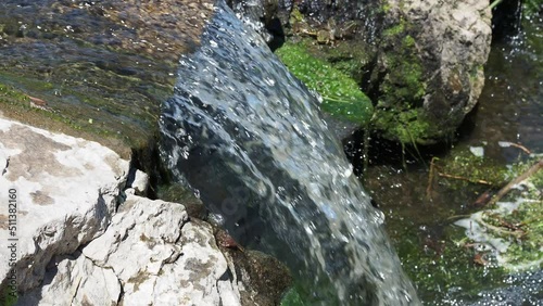 seething stream of water, a cascading waterfall