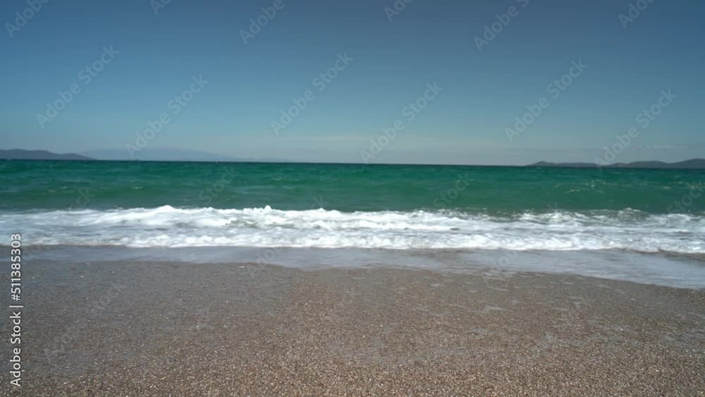 Waves breaking in Slow Motion on Greek Beach. Agean Sea in Greece Waves breaking in Slow Motion on Greek Beach. Agean Sea in Greece