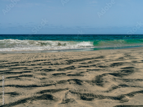 black sand beach and sea