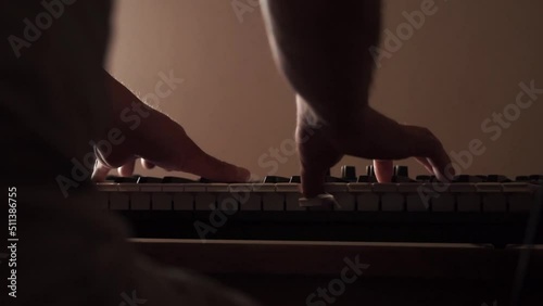 person playing the piano. synthesizer