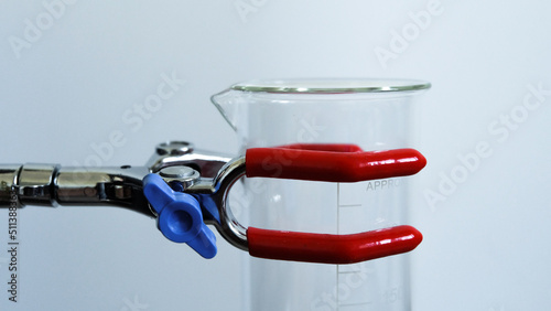 Glass flask in a clip for glasses