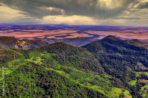 Aerial view of the Ybytyruzu Mountains with the flat plain below in Paraguay from a height of 500 meters. photo