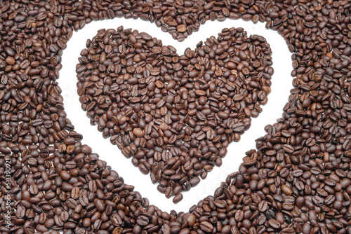 roasted coffee beans forming the shape of a heart, a symbol of love and passion for caffeine and life. (cardiology, health, gastronomy, lifestyle)