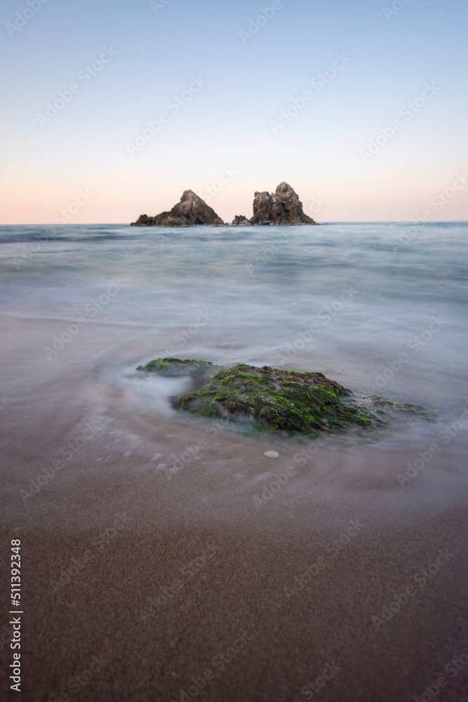 Fototapeta premium Beach and waves at sunset