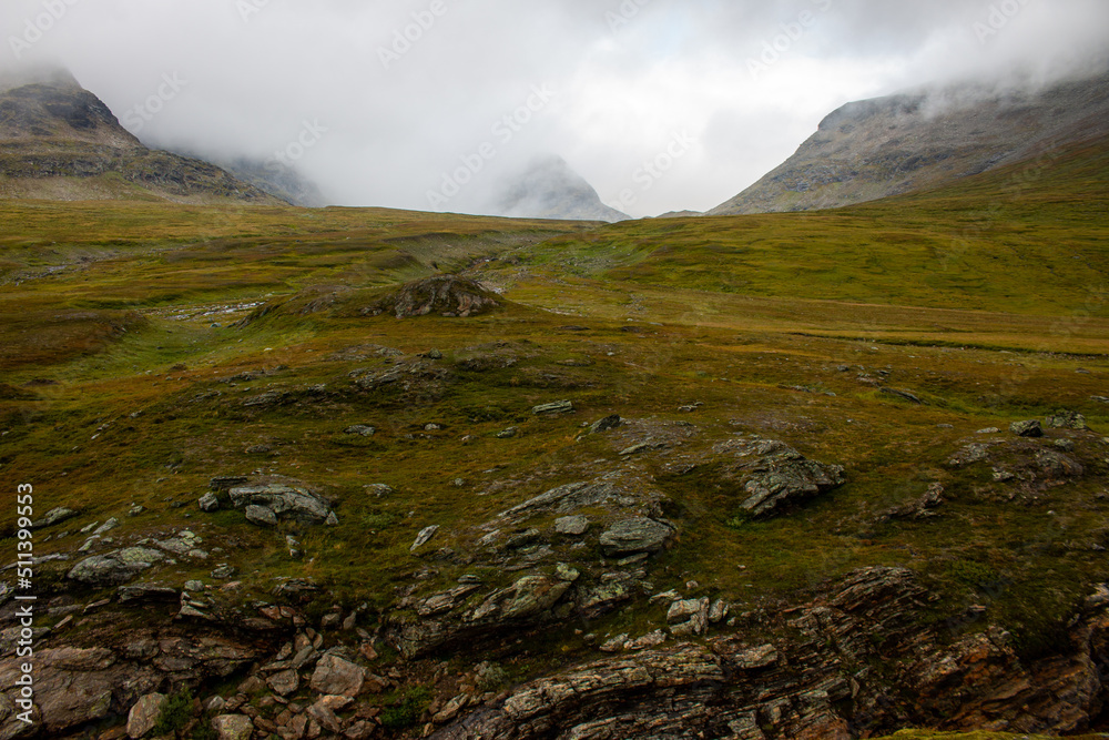 Moody mountains hidden with clouds around Viterskallet hut on Kungsleden hiking trail, July, Lapland, Sweden