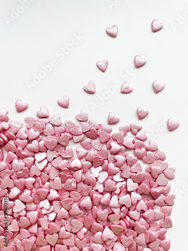 textured background, lots of small decorative candy pink hearts.