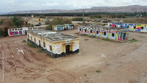 Abandoned barracks painted with graffiti,  Dead sea, drone view
Abandoned barracks of the Jordanian army during the Israeli - Arab conflict
 photo