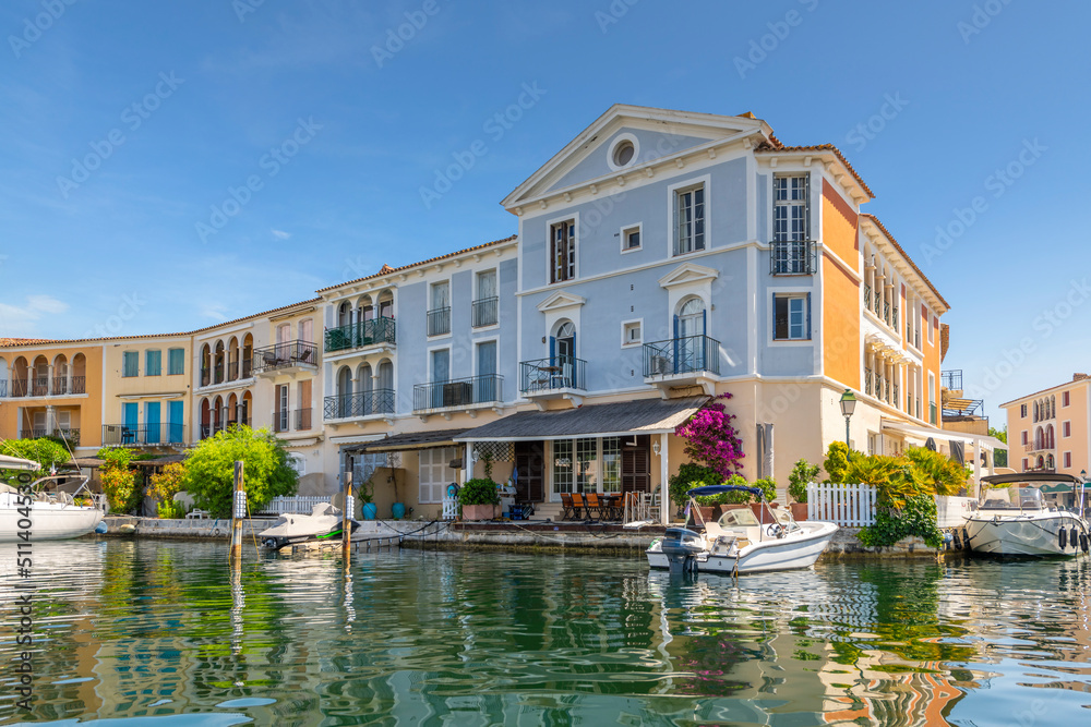 A group of waterfront homes with boat docks in the planned residential community of Port Grimaud, France, along the coast of the French Riviera near Saint-Tropez. A group of waterfront homes with boat docks in the planned residential community of Port Grimaud, France, along the coast of the French Riviera near Saint-Tropez.