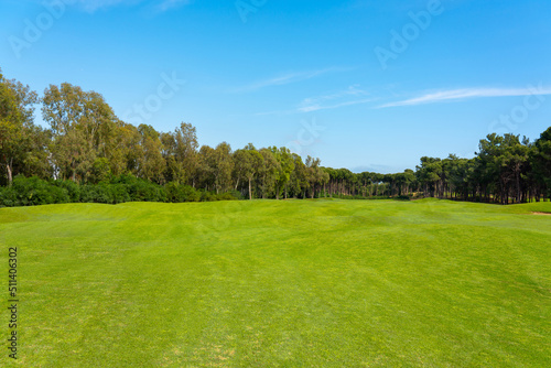 Landscape view of beautiful golf course surrounded with pines in Turkey Belek
