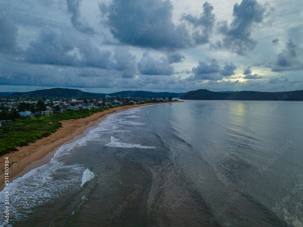 Fototapeta premium Sunrise seascape with rain clouds