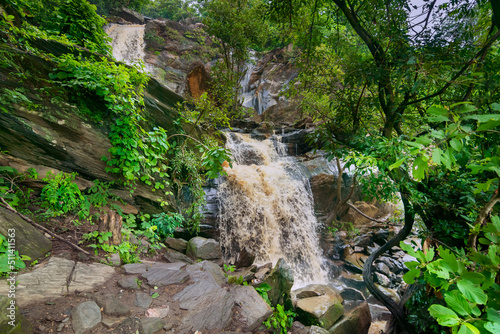 Beautiful Bamni waterfall having full streams of water flowing downhill amongst stones , duriing monsoon due to rain at Ayodhya pahar (hill) - at Purulia, Bengal - formerly West Bengal, India. photo