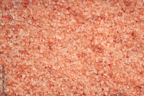 A top view of halit himalaya decorated with bowl in background full of himalaya salt 