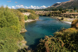 The clear Hawea River flowing between Lake Hawea and Albert Town, Otago, South Island, New Zealand.