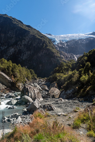 Fast flowing Rob Roy Stream in the foreground with the Rob Roy Glacier in the background. Mount Aspiring National Park, Otago, South Island, New Zealand.