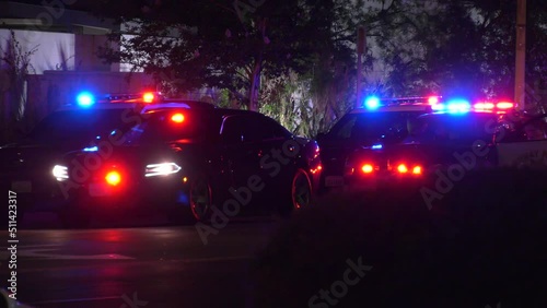cop cars lit up at night  photo
