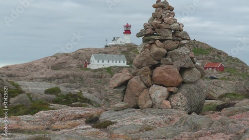 lindesnes coastal lighthouse behind cairn rocky landscape tilt up southermost tip of norway