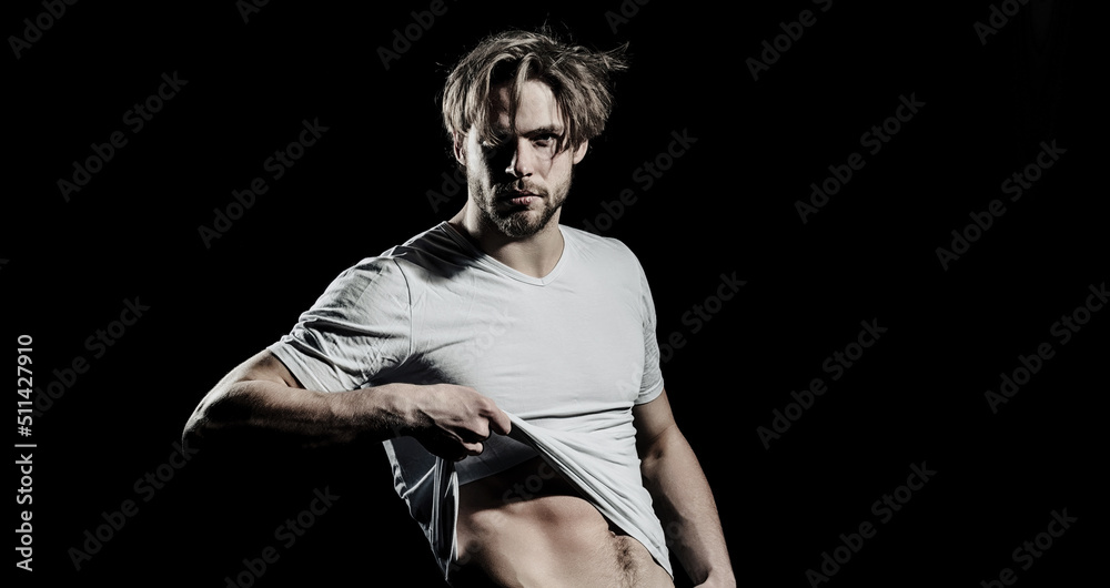 Sexy young handsome naked man on dark background. Seductive gay. Sexy young handsome naked man on dark background. Seductive gay.