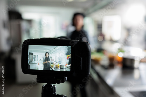 Close up of camera recording head cook presenting herbs and ingredients for dish while doing a cooking course. Culinary content creator preparing gourmet food for internet culinary vlog.