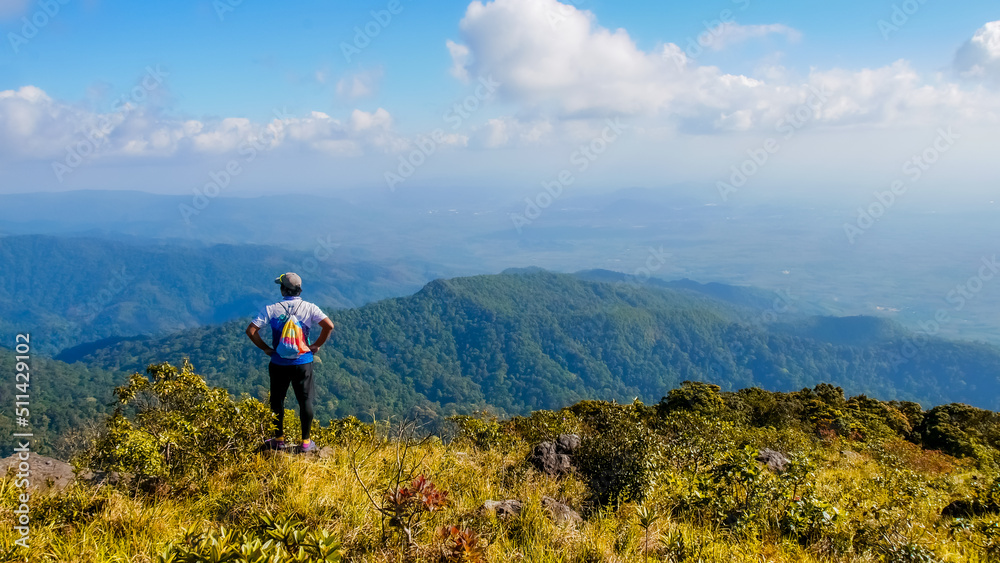 Tourists looking at the beautiful scenery on the high mountains in Thailand. trekking tourism concept