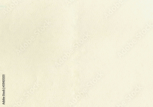 Large image paper texture background with aged uncoated fine fiber grain and dust particles sketch water color paper in light beige yellowed color smooth with copy space for text wallpapers or designs