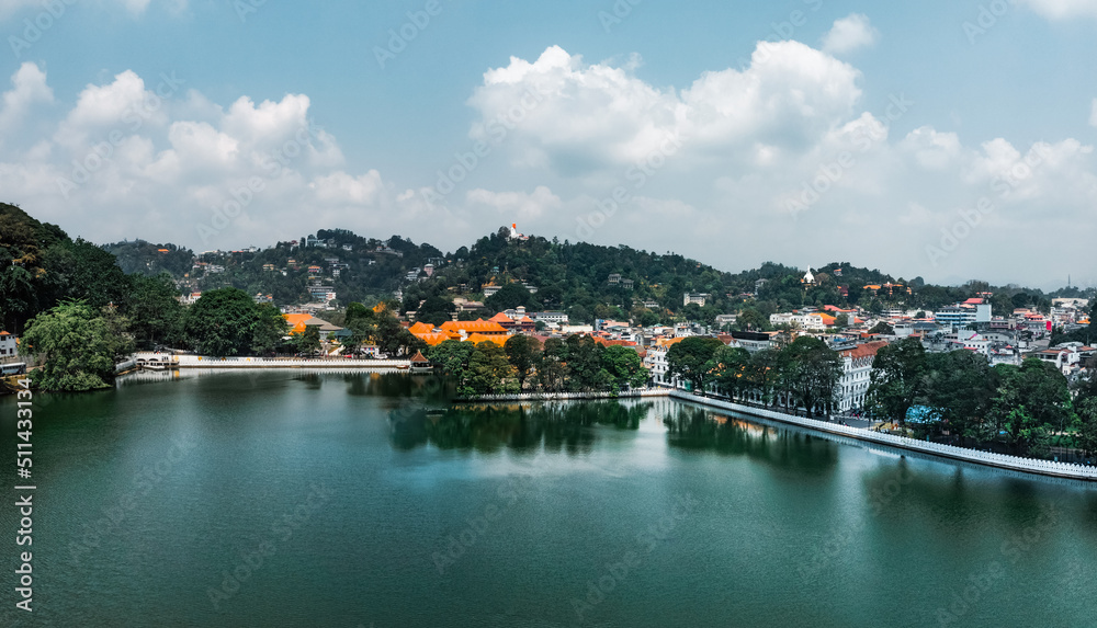 Skyline aerial drone view of Kandy lake, stunning place in the heart of Kandy city in Sri Lanka. Famous historical landmark and religion capital of the country