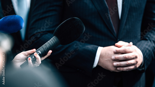 News reporters interviewing a politician.